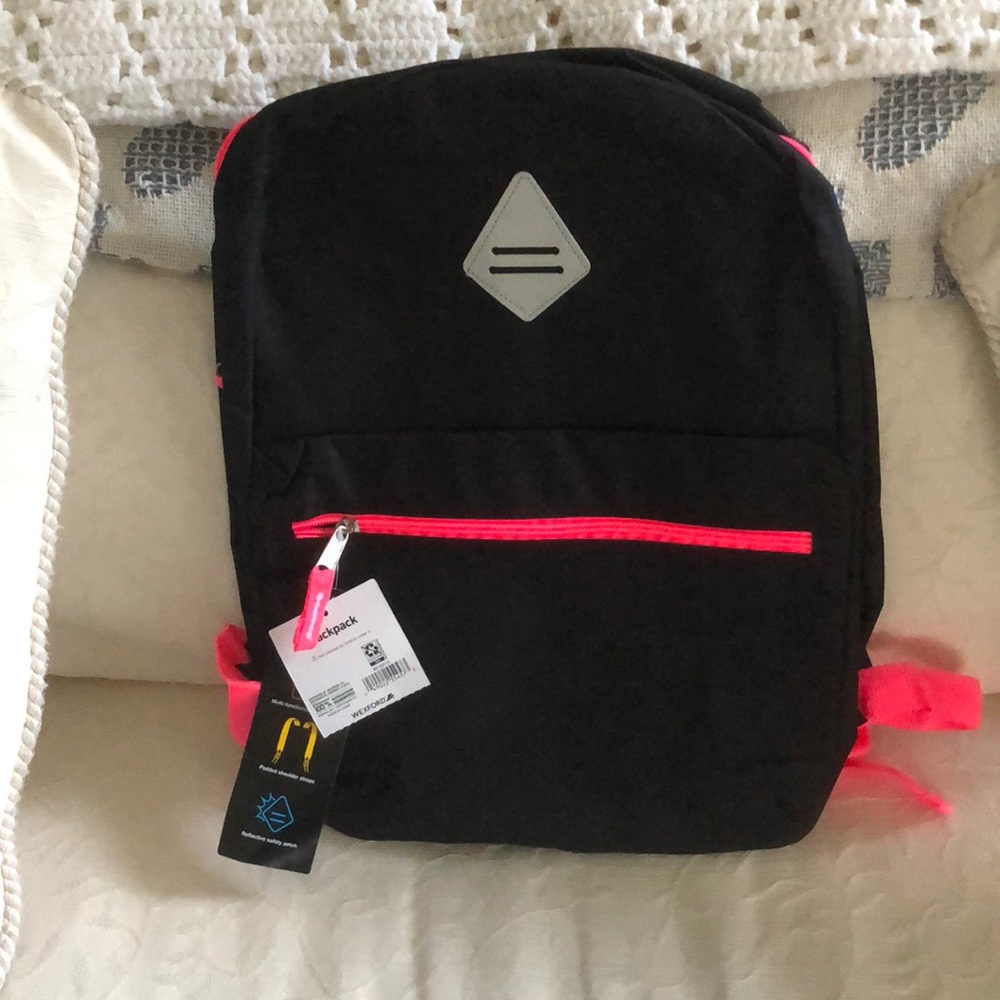 Black back with florets pink zippers and straps.